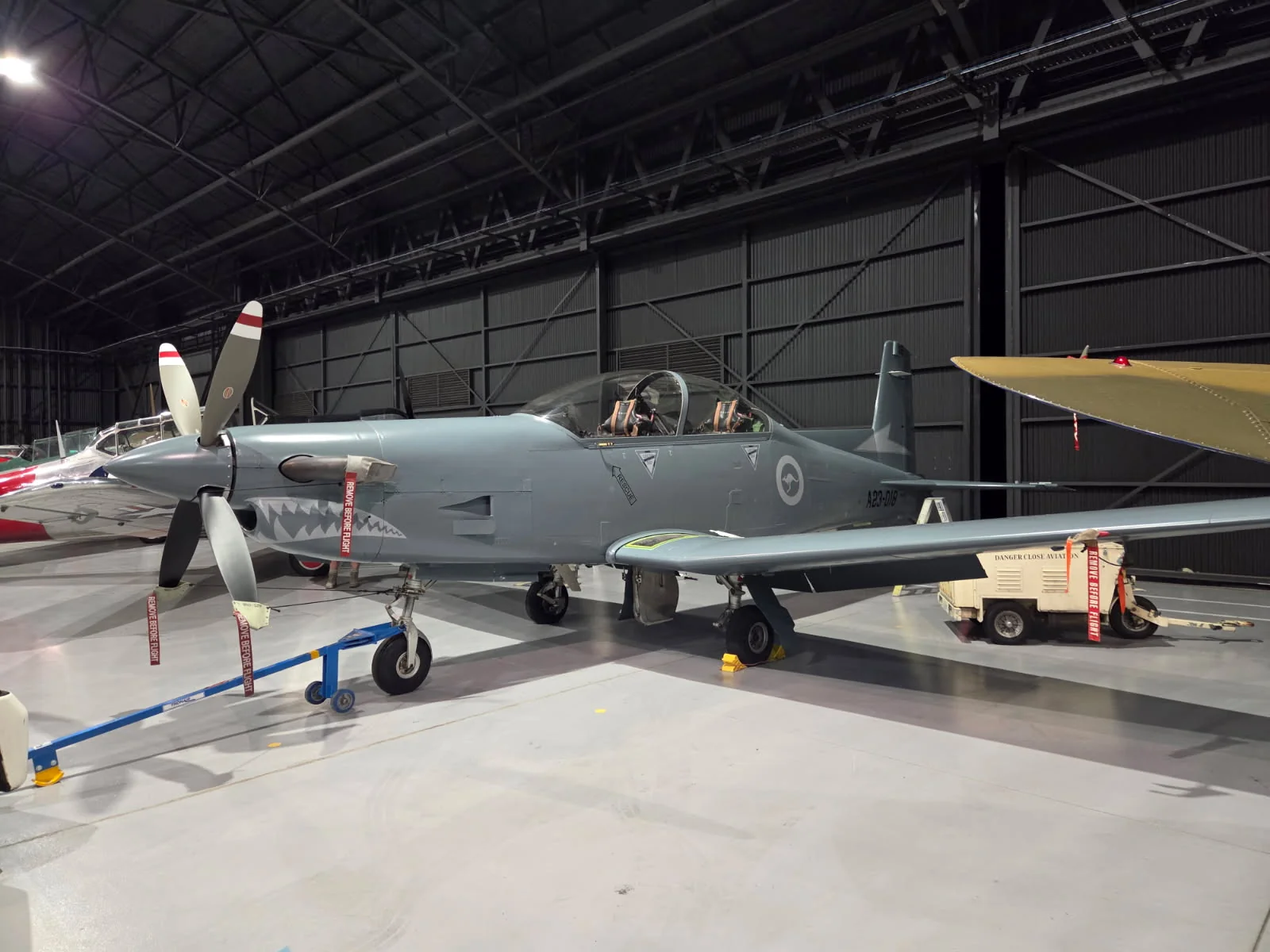 Danger Close Aviation PC-9 A23-018 in its current grey finish with shark-mouth markings