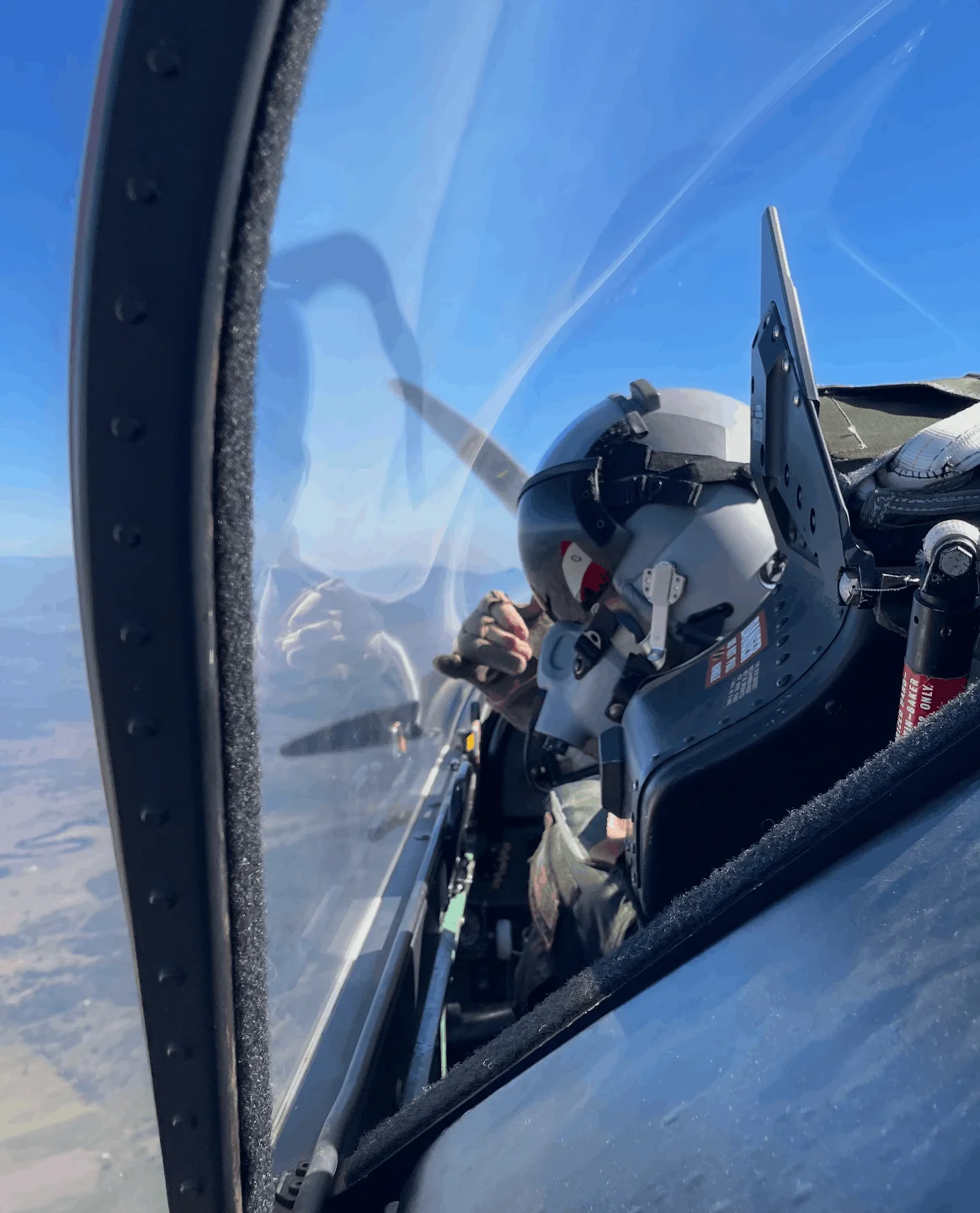 The view inside a PC-9 cockpit in flight